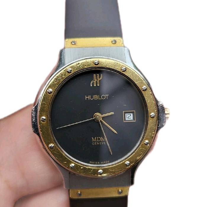 Hublot Jam Tangan MDM Geneve Black Gilt Dial Steel and Gold Dim 30mm Quartz Movement Kondisi Baik He