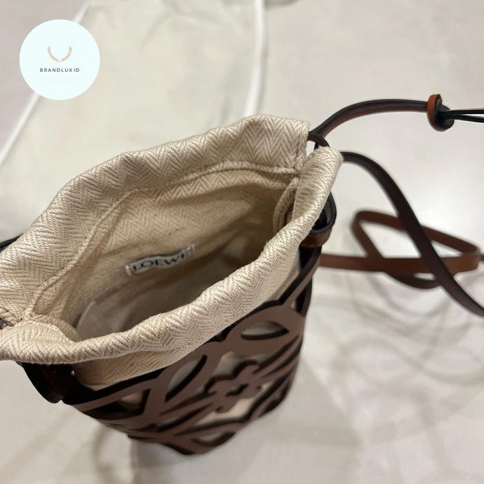 LOEWE ANAGRAM CUT OUT DRAWSTRING POCKET BAG IN TAN