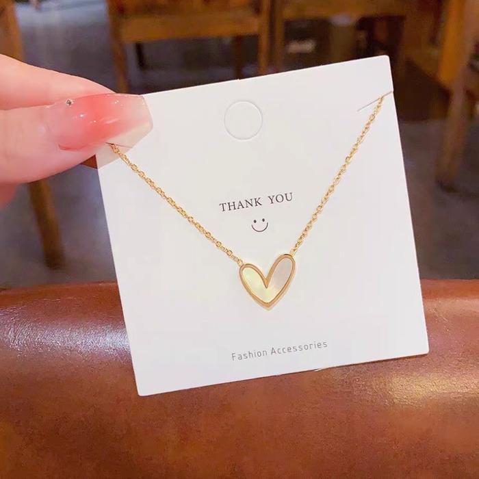 K135 Kalung TITANIUM Wanita Rantai Nori Kecil Bandul Love Keramik Putih Elegant Emas Perhiasan