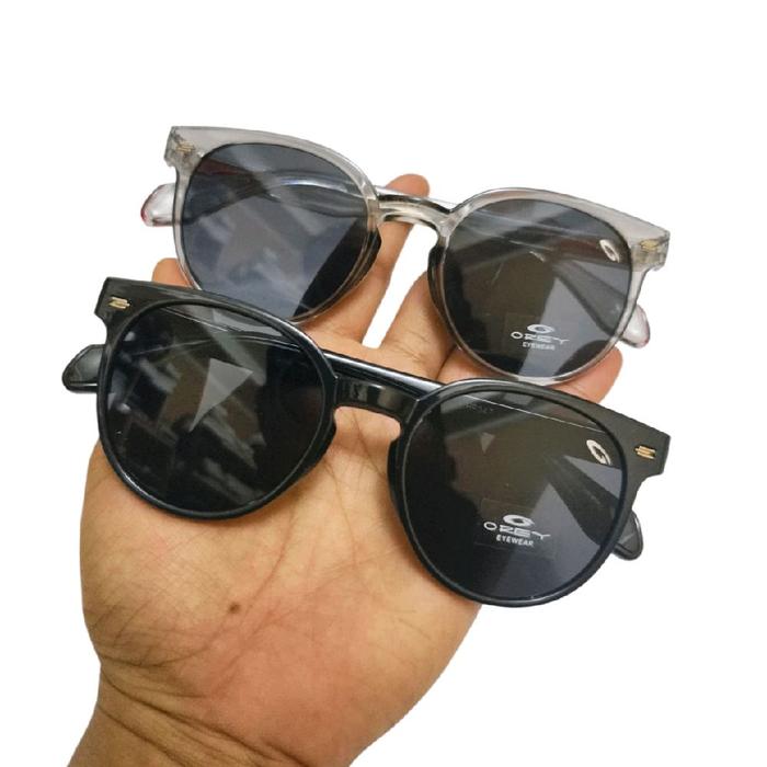 Orey Kacamata Gaya Anti UV Pria dan Wanita dengan Lensa Hitam dan Frame Transparan untuk Perlindunga