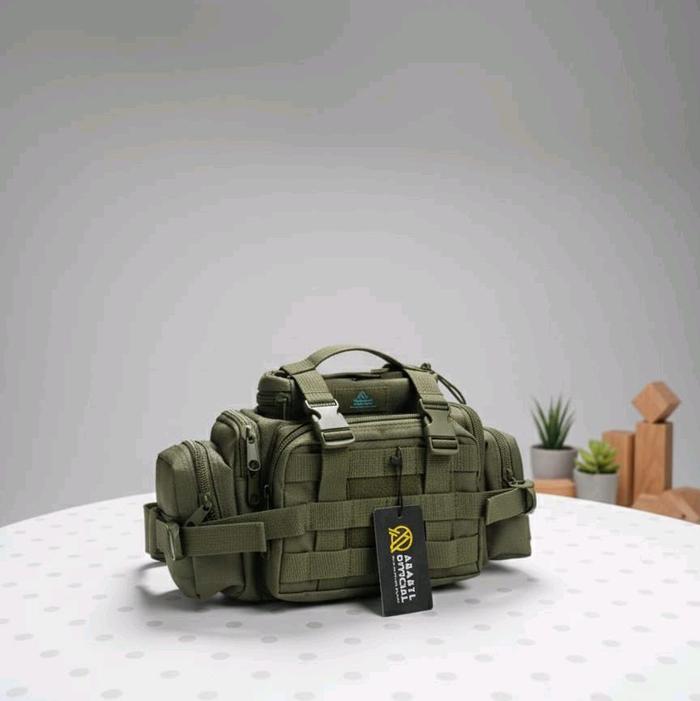 TAS SLEMPANG WARIOR BANDUL BERKUALITAS Tas Sling Pria Modis & Kuat dengan Logo Stylish Bahan Kain Ko