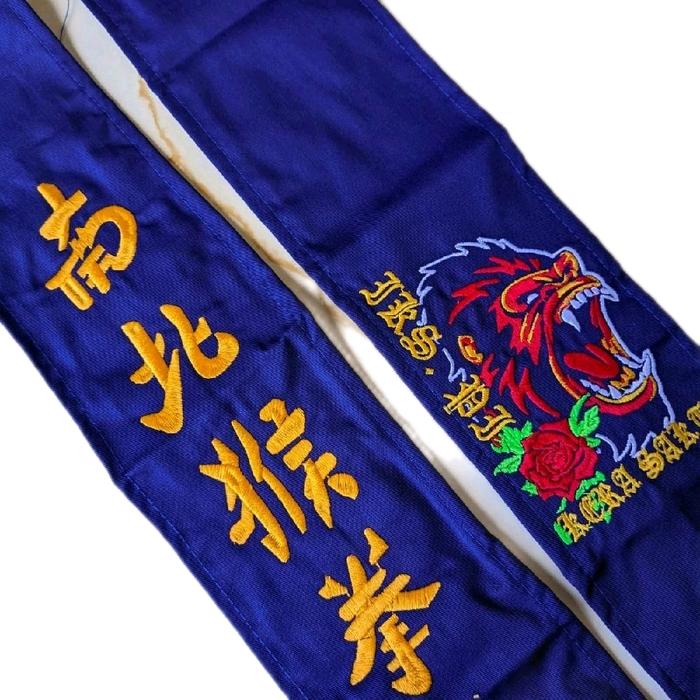 Sabuk Biru Ikspi Kera Sakti Bahan American Drel Motif Bordir Kera dengan Desain Kera