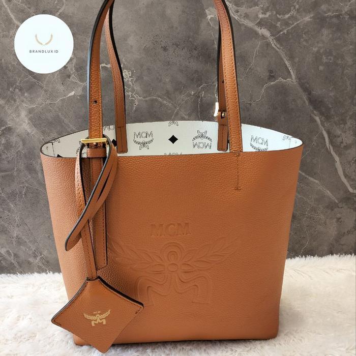MCM HIMMEL REVERSIBLE MINI SHOPPER TOTE BAG IN EMBOSSED LOGO LEATHER COGNAC - MONOGRAM WHITE