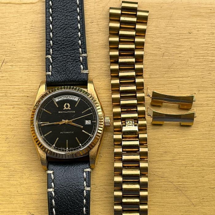 JAM KUNO VINTAGE ANTIK SWISS: TITUS TITUS PRESIDENT DAYDATE BLACK DIAL GOLD PLATED ORIGINAL