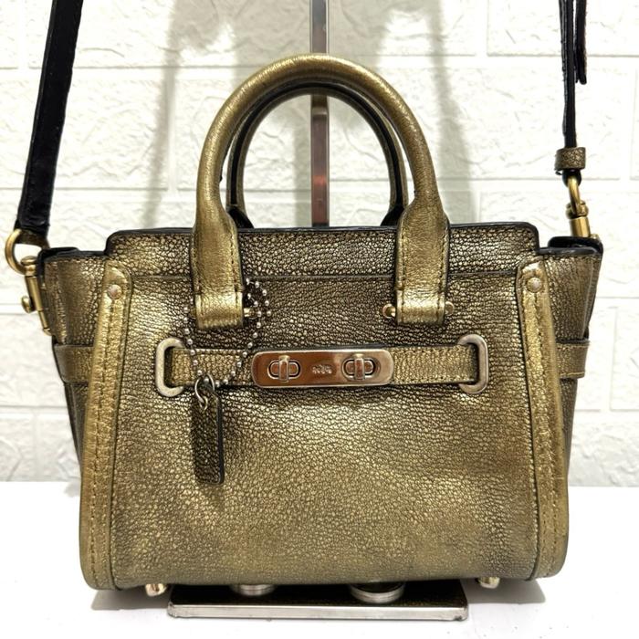 Tas sling bag coc swagger. Tas selempang kulit asli. Tas prelop. Gold gelap