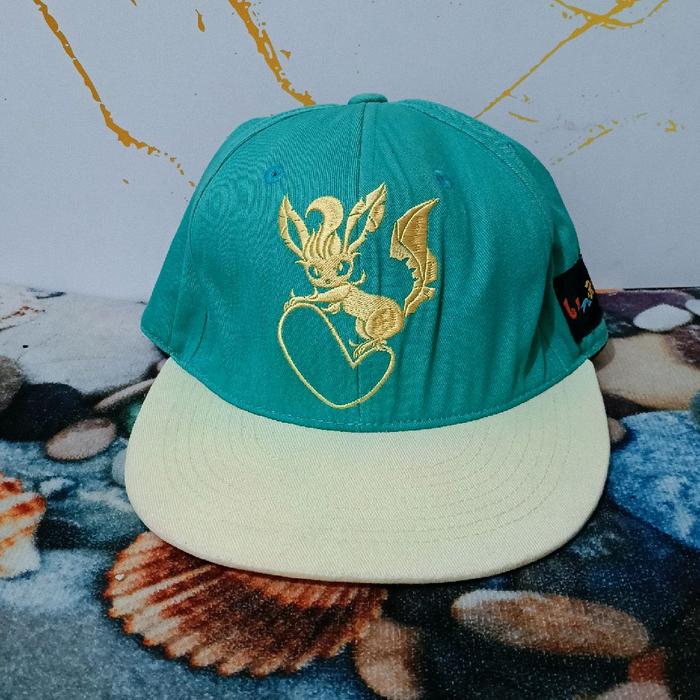Topi Pokemon Center Leafeon Original Bordir Logo Karakter Eevee Collection "Colorful" Free Size Dewa