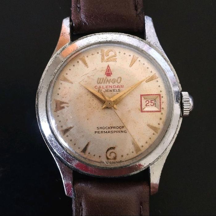 Jam tangan arloji cantik vintage Swiss Made kuno merek Wingo Calendar 17 Jewels Manual Winding Shock