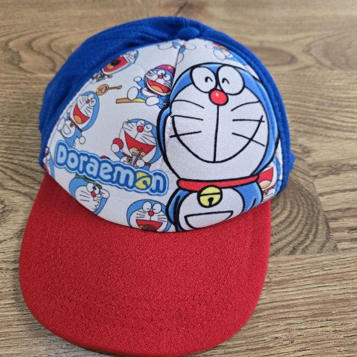 preloved topi anak doraemon