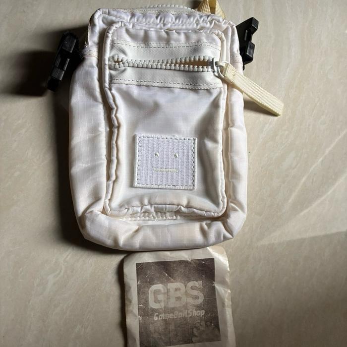 Acne Studios Arvel logo-appliqued ripstop messenger bag in white