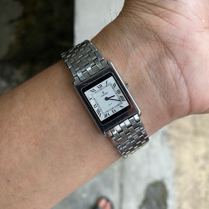 Concord Delirium White Dial Jam Tangan Wanita Mesin Quartz Swiss Made All Original dengan Tali Metal