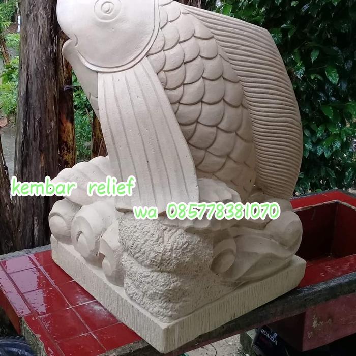 batu alam ukir patung ikan