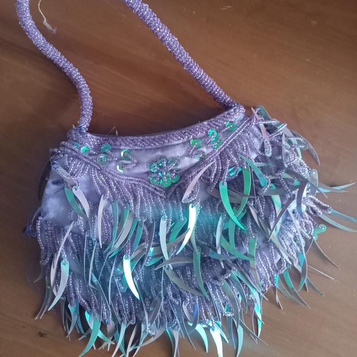 tas manik mute ungu