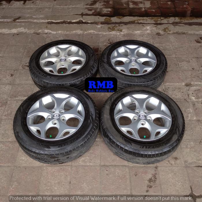 MAZDA BIANTE RING 16 LEBAR 6.5 PCD 5X114.3 ET 50 + BAN DUNLOP 205 65 R