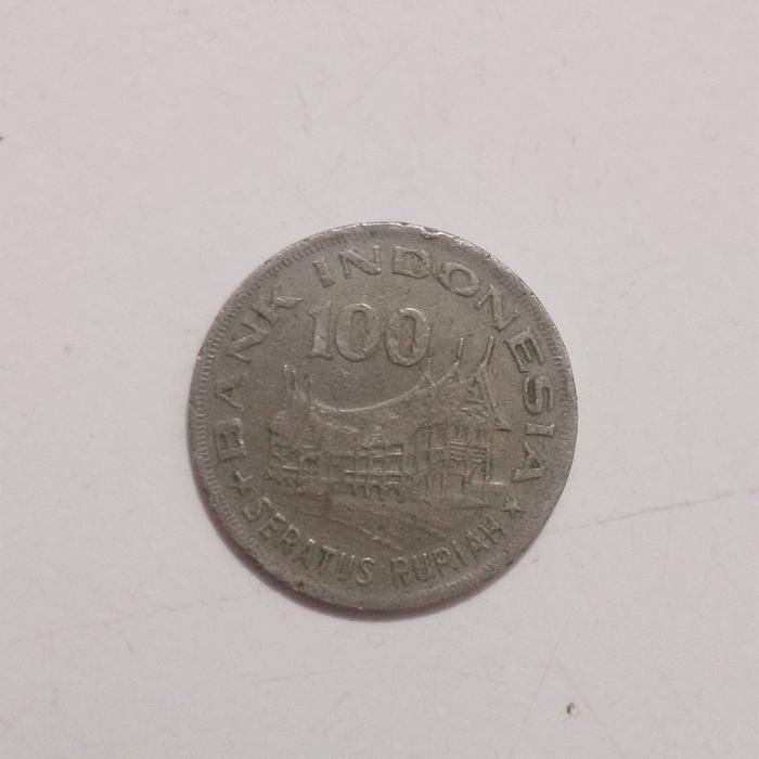 Uang koin 100 rupiah wayang