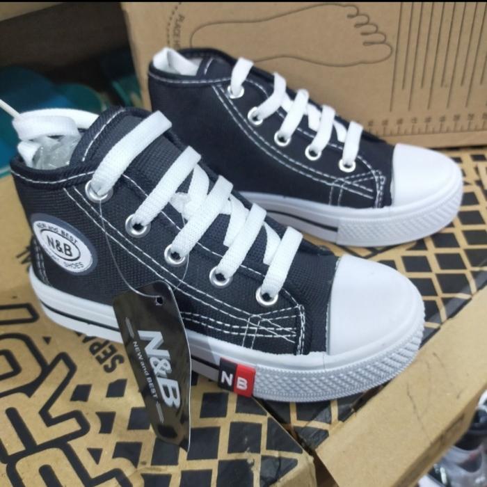 Sepatu anak sekolah warrior nb tali hitam putih