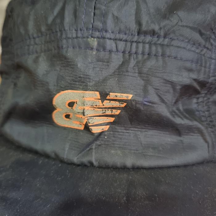 Topi new balance running .