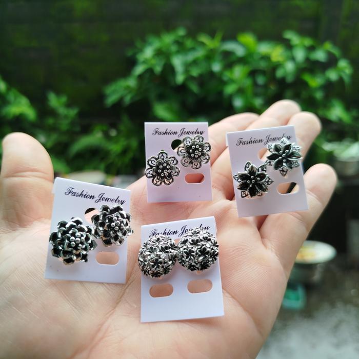 sumpel bahan kuningan lapis perak motif bakar/antik.