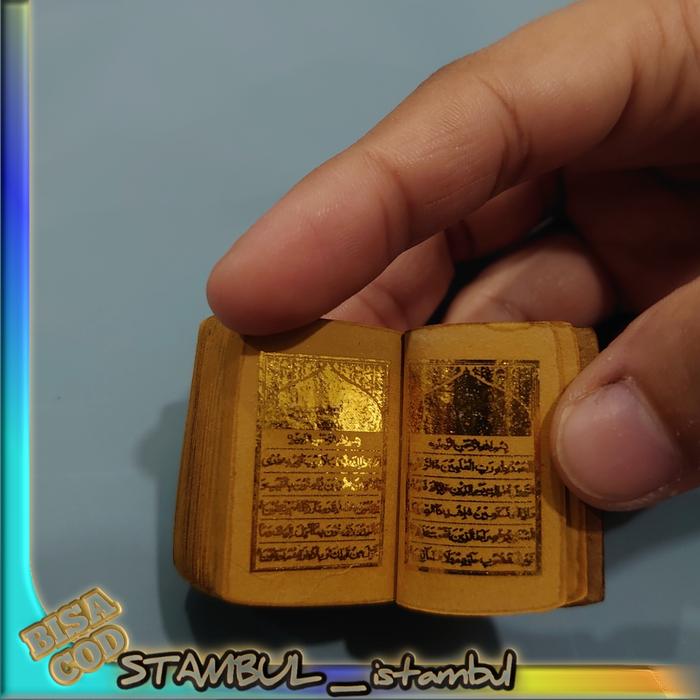 Stambul Al Qur'an pingulan tinta emas wadah antik ada kaca pembesar