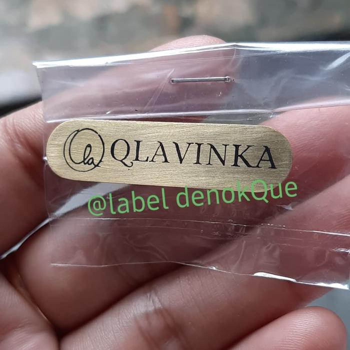 label plat Tas